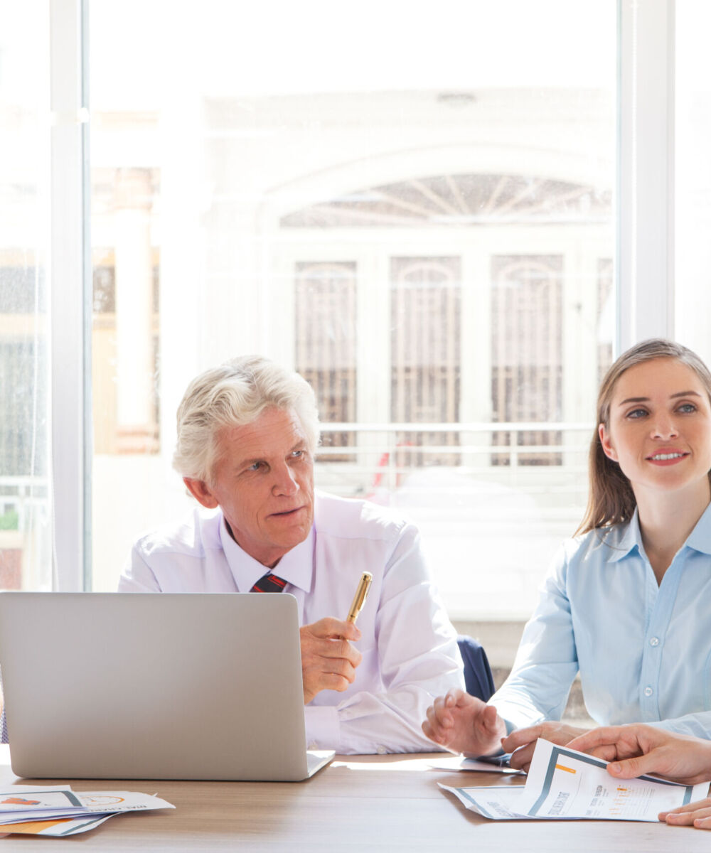 Group of four people discussing business issues