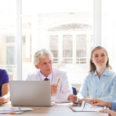 Group of four people discussing business issues